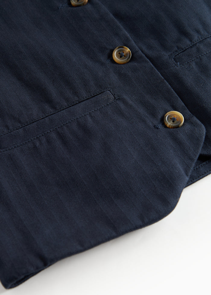 Dark blue vest with buttons and pockets for children