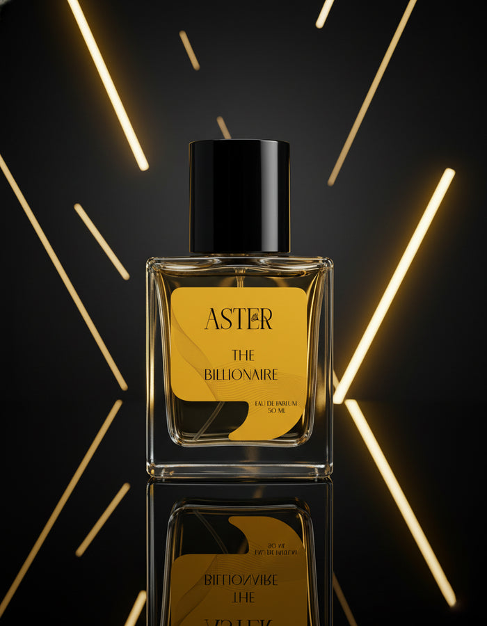 Perfume bottle labeled 'Aster The Billionaire' with a gold label on a reflective surface and geometric light background.