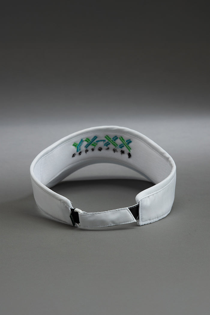 White visor with embroidered design on a gray background || white