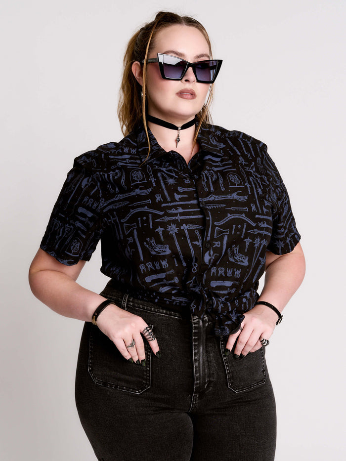 short-sleeve button-down that mixes crisp classic shirting with dark, gothic illustration.