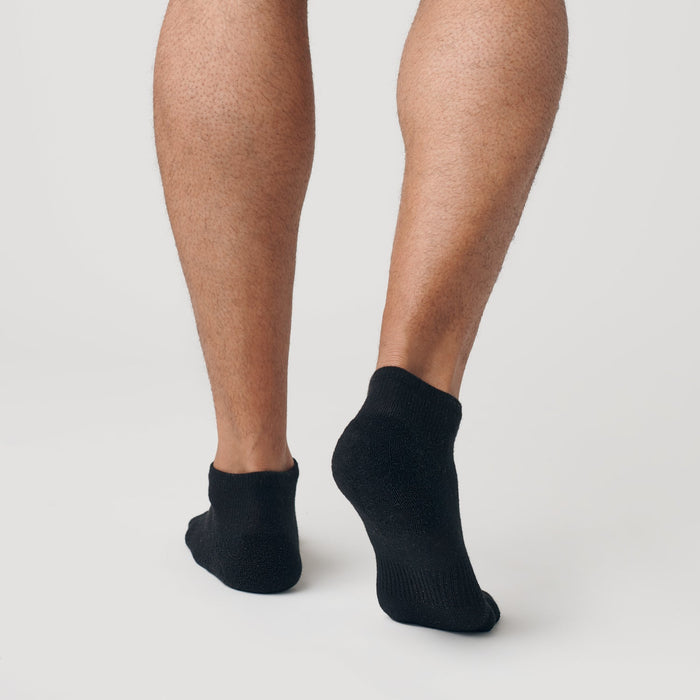 Black Ankle Socks Single on feet, showcasing seamless toe and contour seams.