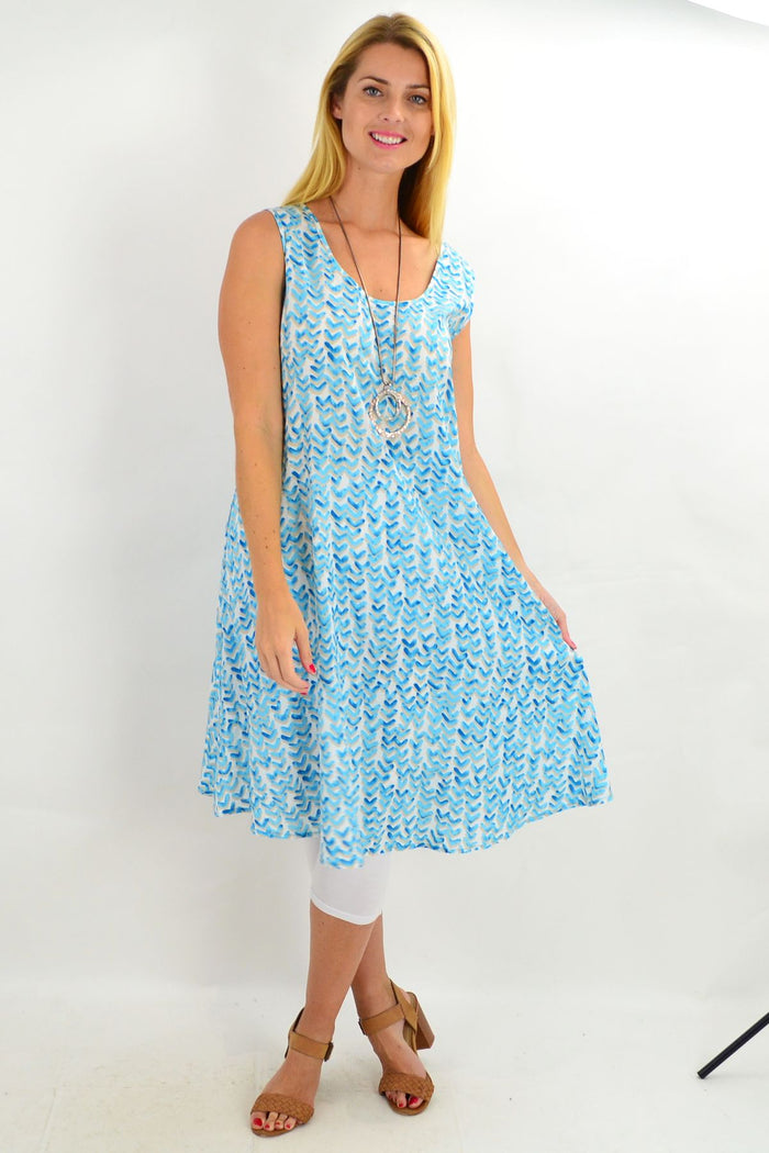 Aqua blue sleeveless boomerang A-line shift tunic dress by Cordelia St, showcasing its relaxed fit and simple design.