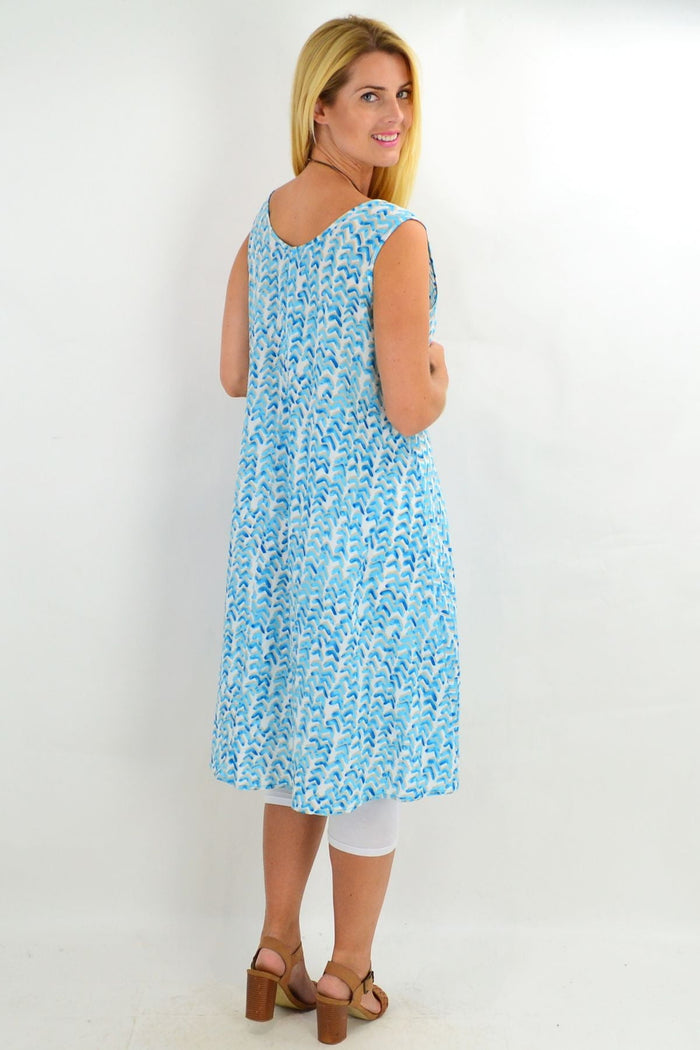 Aqua sleeveless boomerang A-line shift tunic dress by Cordelia St, featuring a relaxed fit and stylish design.