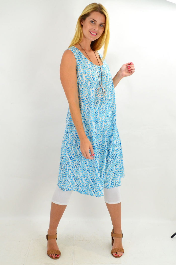 Blue Boomerang A-line shift tunic dress by Cordelia St, featuring a relaxed fit and stylish design, displayed on a hanger.