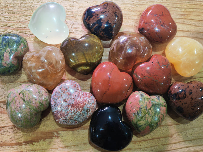 Collection of multicolored heart-shaped stones available at Earthstore