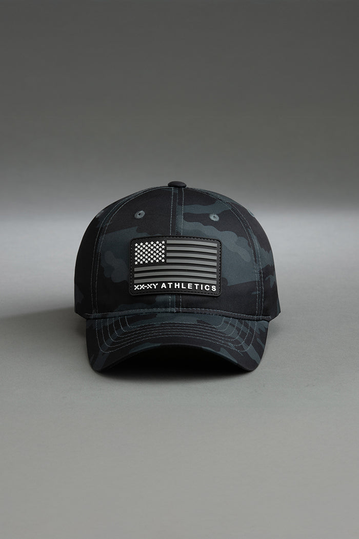 Black and gray camouflage cap with American flag patch on a gray background || Black Camo