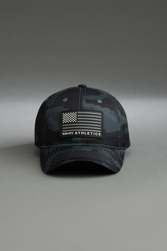 Black and gray camouflage cap with American flag patch on a gray background || Black Camo