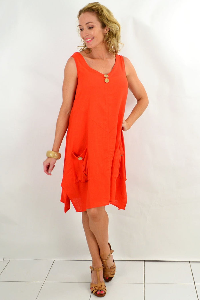 Ruby Rain Costa Rica Vivid Orange Tunic Dress hanging on a mannequin, showcasing its bright color and relaxed fit.