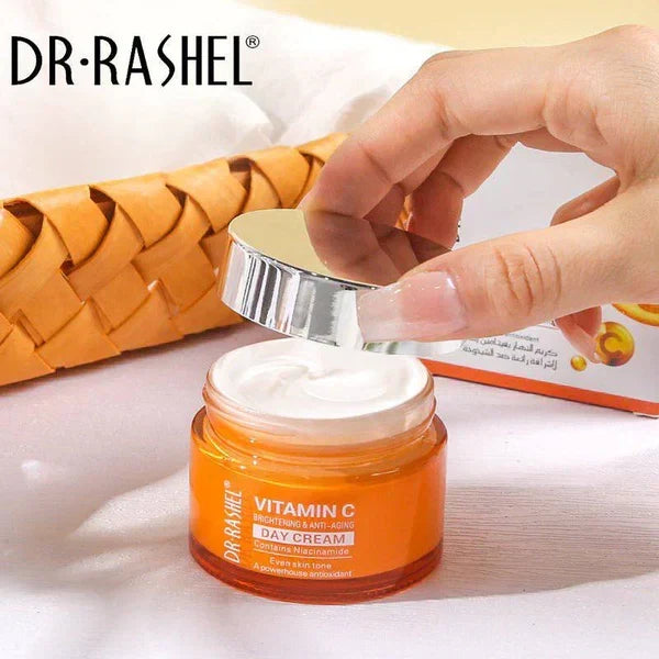 Dr. Rashel Vitamin C cream jar with a hand opening it on a light background