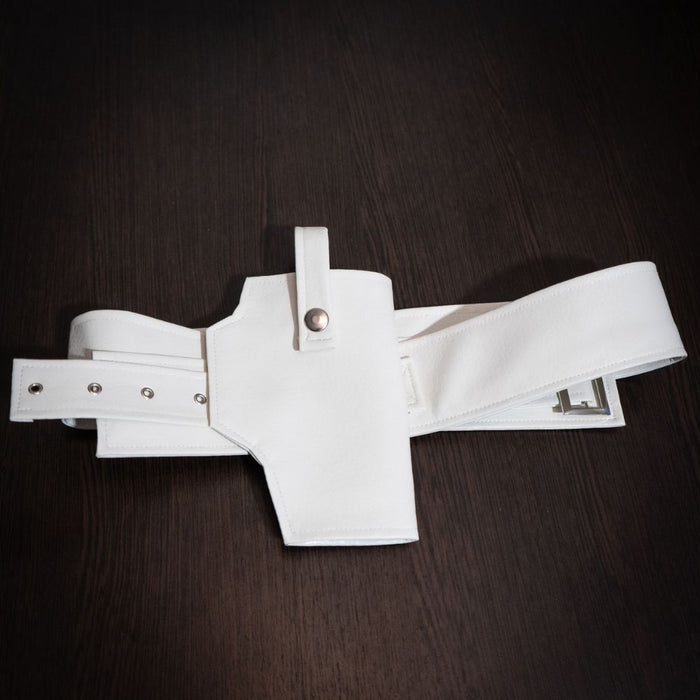 White belt with multiple straps on a dark wooden surface