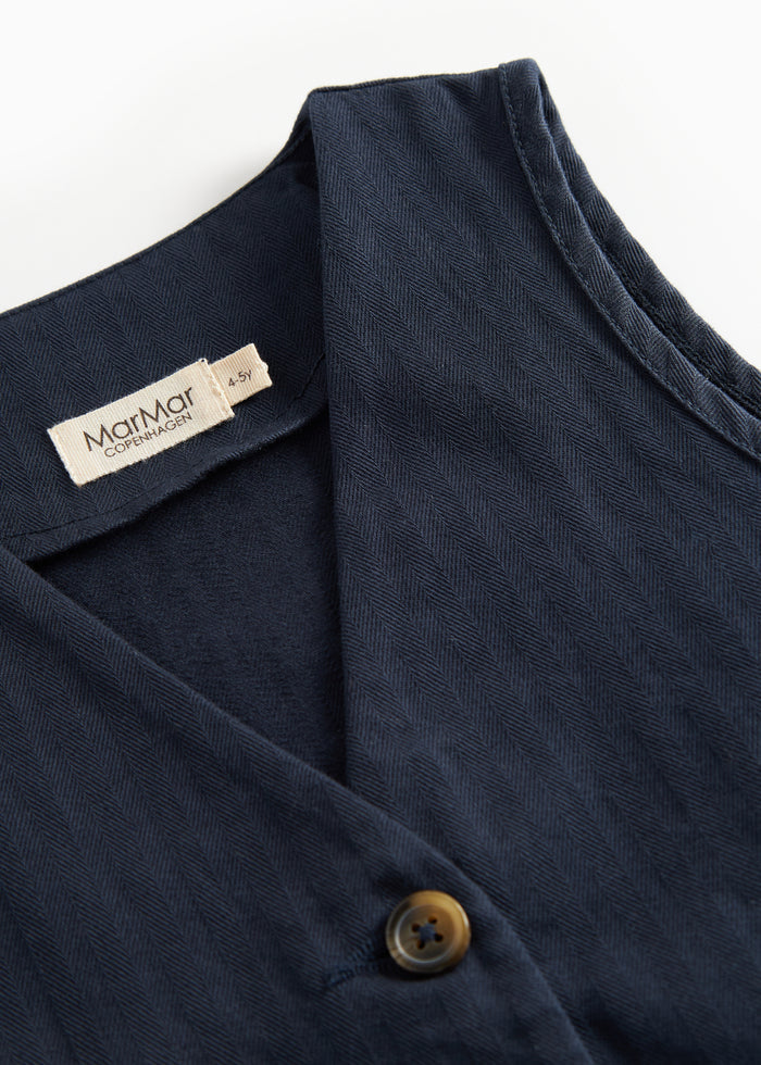 Dark blue vest with buttons and pockets for children