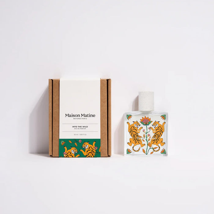 Maison Matine Into the Wild perfume bottle with its box on a white background.