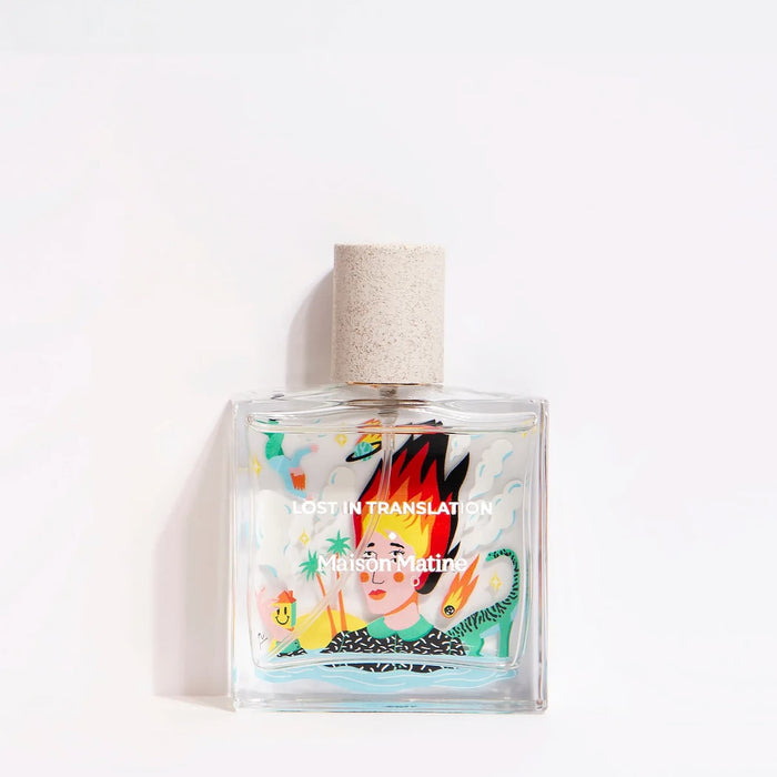 Perfume bottle with colorful label on a white background