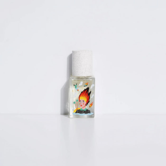 Small bottle with a colorful label featuring a face on a white background