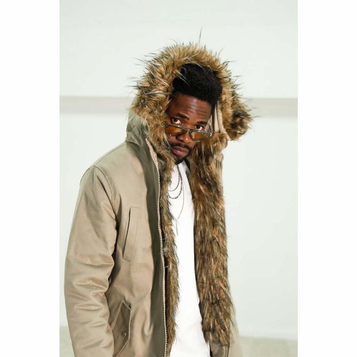 Martin Valen beige parka-style jacket worn with hood up, three-quarter view highlighting the furry inner trim.