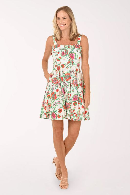Woman wearing a floral dress on a white background