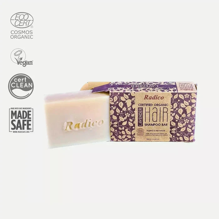 A packaged Radico organic shampoo bar with lavender scent, next to the bar with the brand name visible.